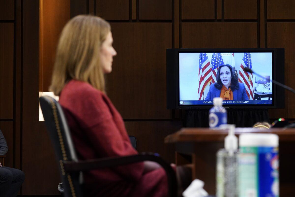 Democratic vice presidential candidate Sen. Kamala Harris (D-Calif.) is seen on a television screen asking questions via video link of Supreme Court nominee Amy Coney Barrett, in Washington on Oct. 14, 2020. (Patrick Semansky/Pool/Getty Images)