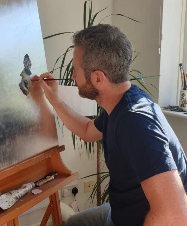 Andrew Pledge paints an impala onto silver leaf in his studio in Beckenham, southeast England. (Courtesy of Andrew Pledge)