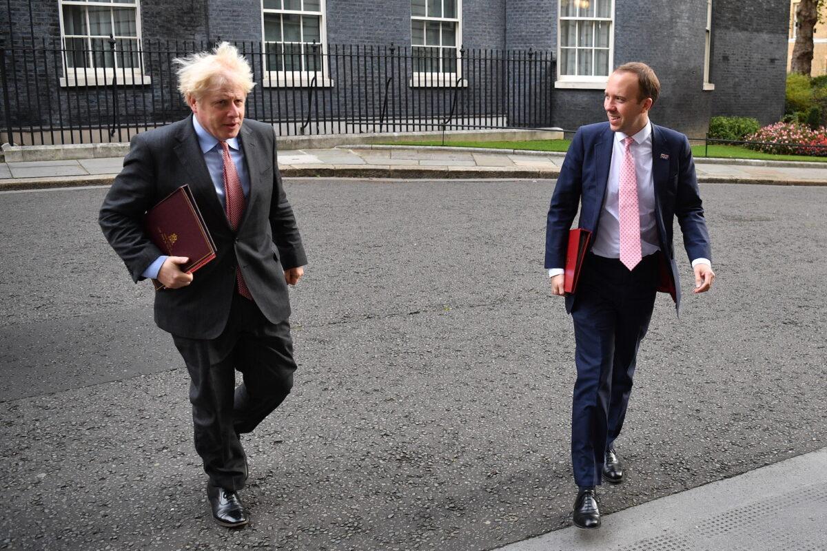 Prime Minister Boris Johnson and Secretary of State for Health and Social Care Matt Hancock walk from Downing Street to the Foreign and Commonwealth Office on Sept. 30, 2020. (Leon Neal/Getty Images)