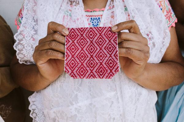 Mexican crafts are full of meaning. Every color and pattern tells the history of the village it was made in. The pattern on this hand-embroidered square represents the four cardinal directions and the rising sun. (Someone Somewhere)