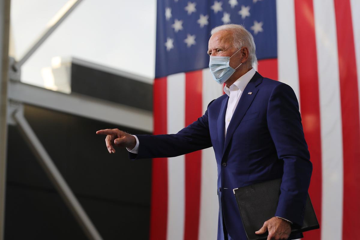Democratic presidential nominee Joe Biden points to supporters during a drive-in voter mobilization event at Miramar Regional Park in Miramar, Fla., on Oct. 13, 2020. (Somodevilla/Getty Images)
