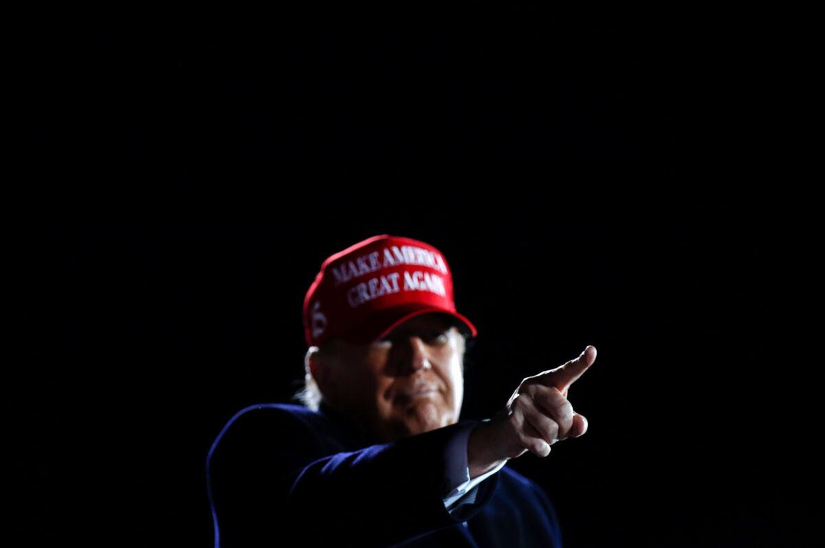 President Donald Trump points his finger during a campaign rally at Des Moines International Airport in Des Moines, Iowa, on Oct. 14, 2020. (Carlos Barria/Reuters)