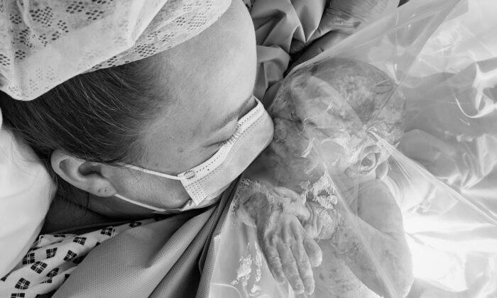 Poignant Image of Mom’s First Kiss to Newborn Shows Reality of Giving Birth During Lockdown