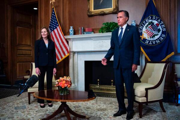 Supreme Court nominee Amy Coney Barrett and Sen. Mitt Romney (R-Utah) conduct a photo op in the US Capitol before Coney Barrett met with Senators throughout the day in Washington, on Sept. 30, 2020. (Tom Williams/POOL/AFP via Getty Images)