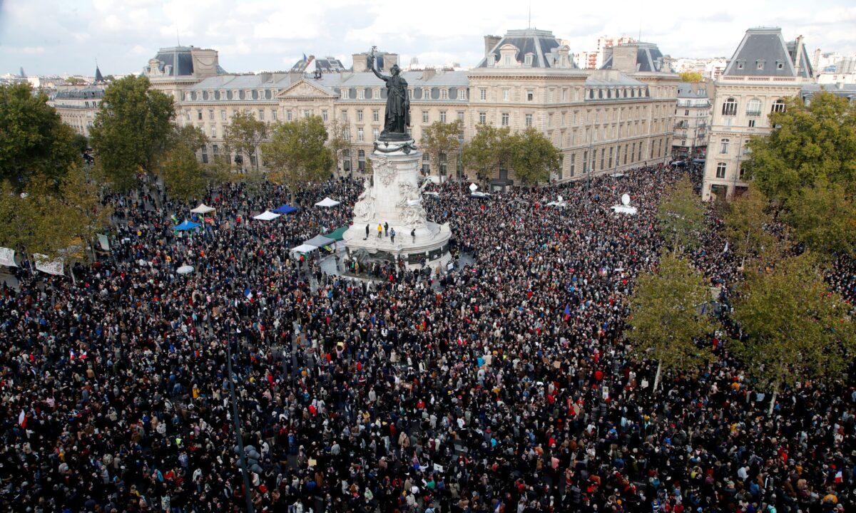 Thousands of people gather during a demonstration in support of freedom of speech and to pay tribute to French history teacher Samuel Paty, in Republique square, Paris, on Oct. 18, 2020 (Michel Euler/AP Photo)