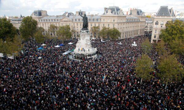 Hundreds of people gather on Republique square during a demonstration in Paris on Oct. 18, 2020. Demonstrations were held around France in support of freedom of speech and to pay tribute to slain history teacher Samuel Paty. (Michel Euler/AP Photo)