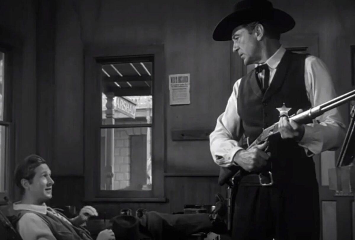 Deputy Marshal Harvey Pell (Lloyd Bridges, L) has little interest in helping Marshall Will Kane (Gary Cooper) catch the bad guys, in “High Noon.” (United Artists)