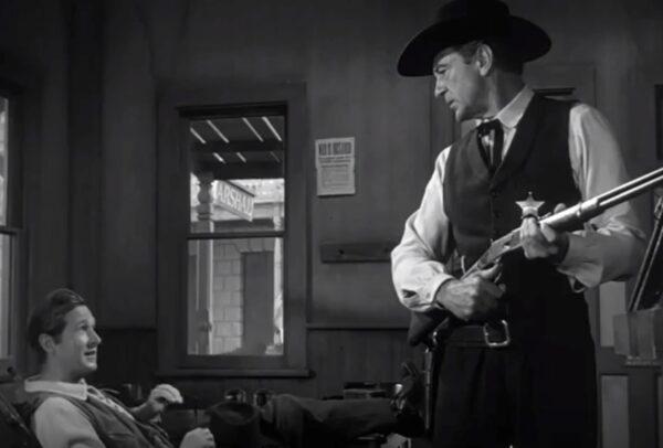Deputy Marshal Harvey Pell (Lloyd Bridges, L) has little interest in helping Marshal Will Kane (Gary Cooper) catch the bad guys, in “High Noon.” (United Artists)