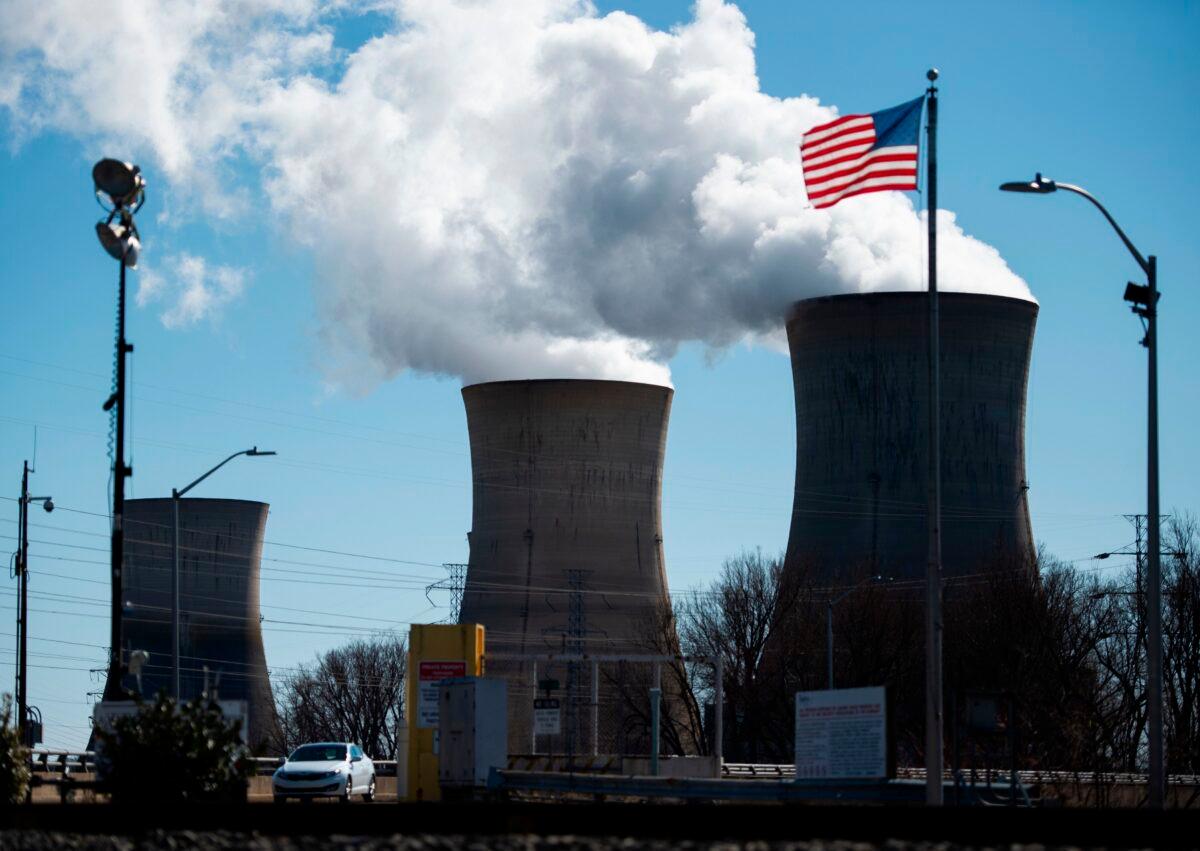 A car leaves the nuclear plant on Three Mile Island, with the operational plant run by Exelon Generation on the right, in Middletown, Pa. (Andrew Caballero-Reynolds/AFP via Getty Images)
