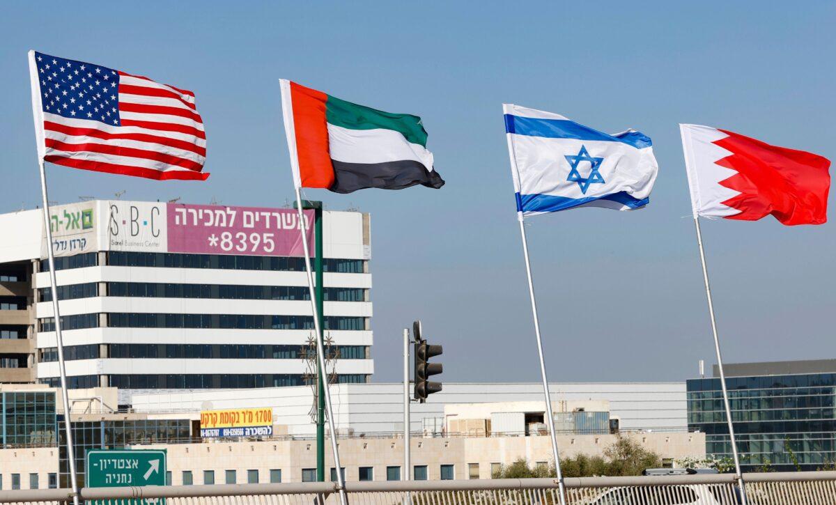 (L-R) The flags of the United States, the United Arab Emirates, Israel, and Bahrain are flown along a road in Netanya, Israel, on Sept. 13, 2020, marking the signing on Sept. 15 of the Abraham Accords Peace Agreement. (Jack Guez/AFP via Getty Images)