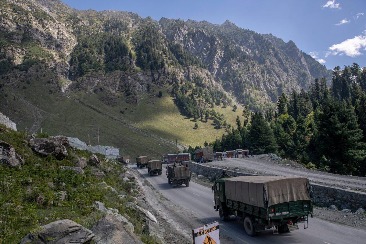 An Indian army convoy moves on the Srinagar-Ladakh highway at Gagangeer, northeast of Srinagar, in Indian-controlled Kashmir, India, on Sept. 9, 2020. (Dar Yasin/AP Photo)