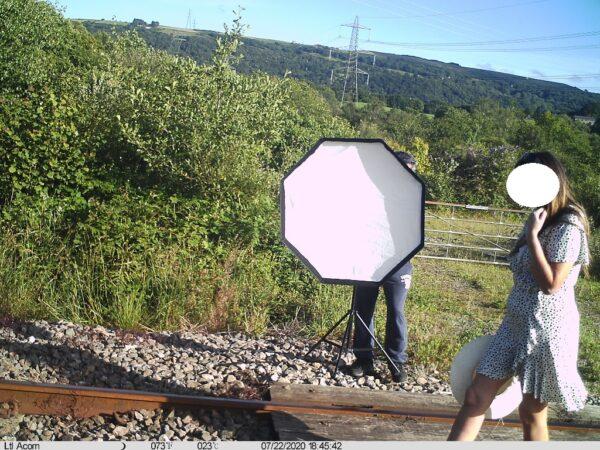 A CCTV still shows a woman on the train line at Cilfrew, United Kingdom, on an unspecified date in summer 2020. (Network Rail)