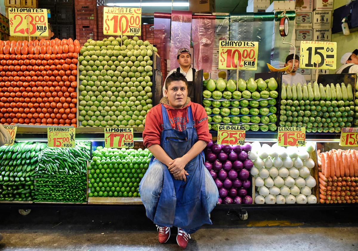 A fruit vendor at the Central de Abasto wholesale market in Mexico City on Dec. 19, 2017. (ALFREDO ESTRELLA/AFP via Getty Images)