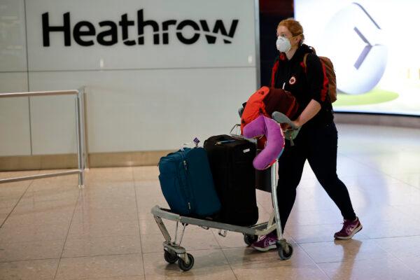 A passenger arrives at Terminal 2 of Heathrow Airport, west London, on May 22, 2020. (Tolga Akmen/AFP via Getty Images)
