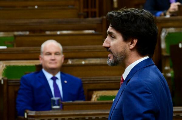 Prime Minister Justin Trudeau answers a question in the House of Commons as Conservative Leader Erin O'Toole looks on, on Parliament Hill in Ottawa on Oct. 21, 2020. (The Canadian Press/Sean Kilpatrick)