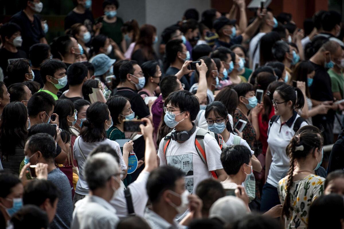Students walk outside a school after finishing the National College Entrance Examination, known as "gaokao," outside a school in Wuhan, in central China's Hubei Province, on July 8, 2020. (STR/AFP via Getty Images)