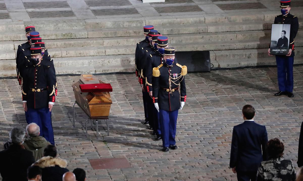 The casket of slain teacher Samuel Paty is laid in the courtyard of the Sorbonne university during a national memorial event, in Paris on Oct. 21, 2020. (Francois Mori/Pool via Reuters)