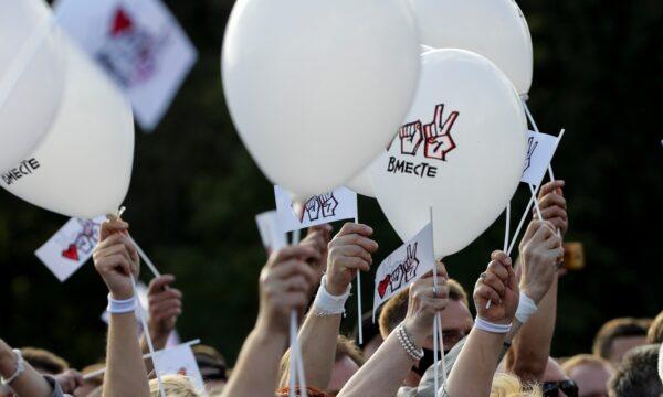 People wave white balloons with the words "Together" as they attend a meeting in support of Sviatlana Tsikhanouskaya in Minsk, Belarus, on July 30, 2020. (Sergei Grits/AP Photo)