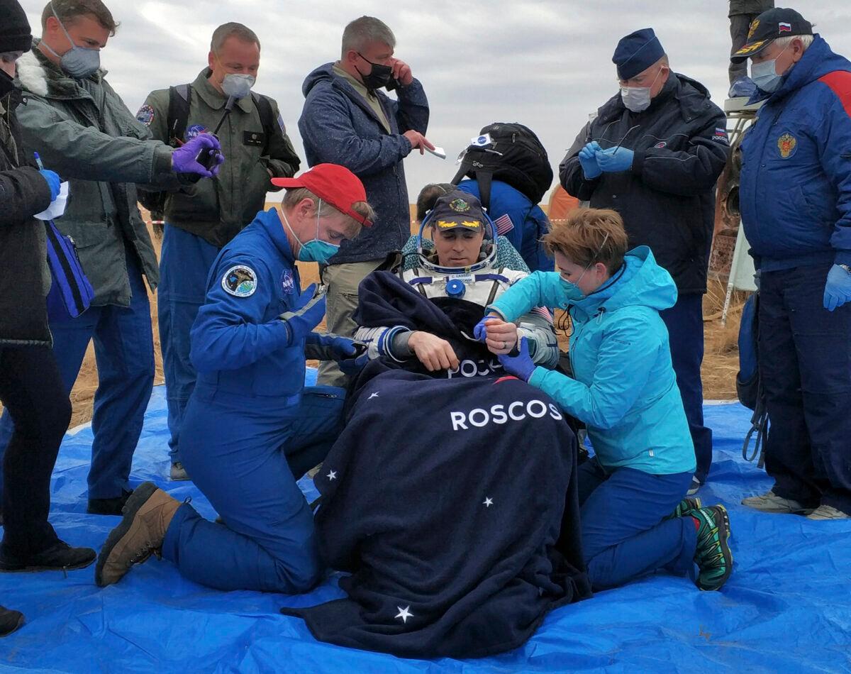 NASA astronaut Chris Cassidy sits in a chair shortly after the landing near town of Dzhezkazgan, Kazakhstan, on Oct. 22, 2020 (Rosaviatsiya via AP)