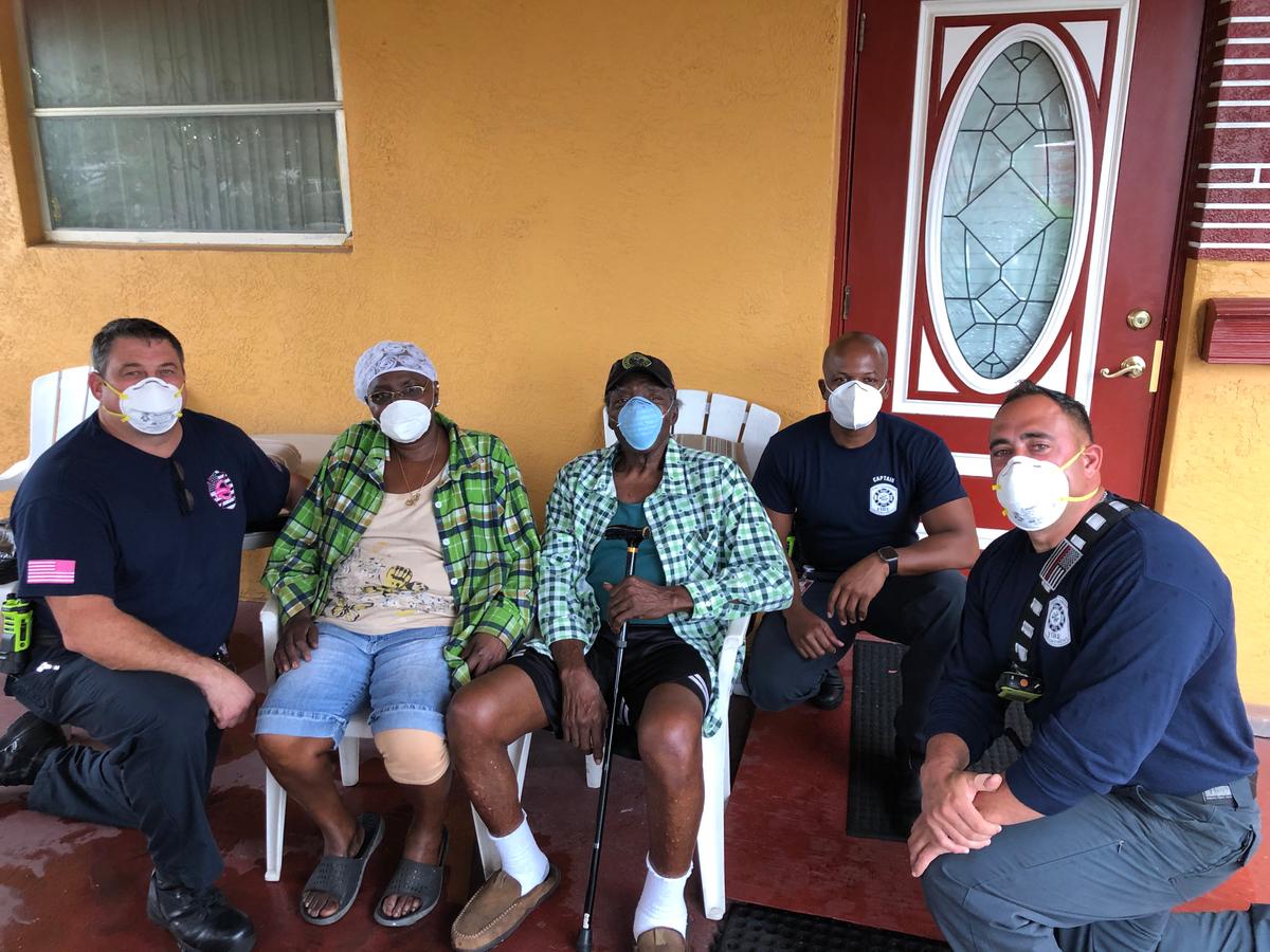 Prince Pinkney and his wife, Rebecca, with the Fort Lauderdale Fire Rescue Station 47 crew (Courtesy of <a href="https://www.facebook.com/FLFR411/">Fort Lauderdale Fire Rescue</a>)