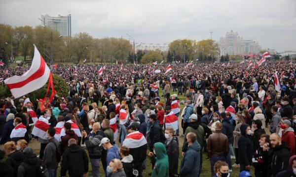 People attend an opposition rally to reject the Belarusian presidential election results in Minsk, on Oct. 25, 2020. (Stringer/Reuters)