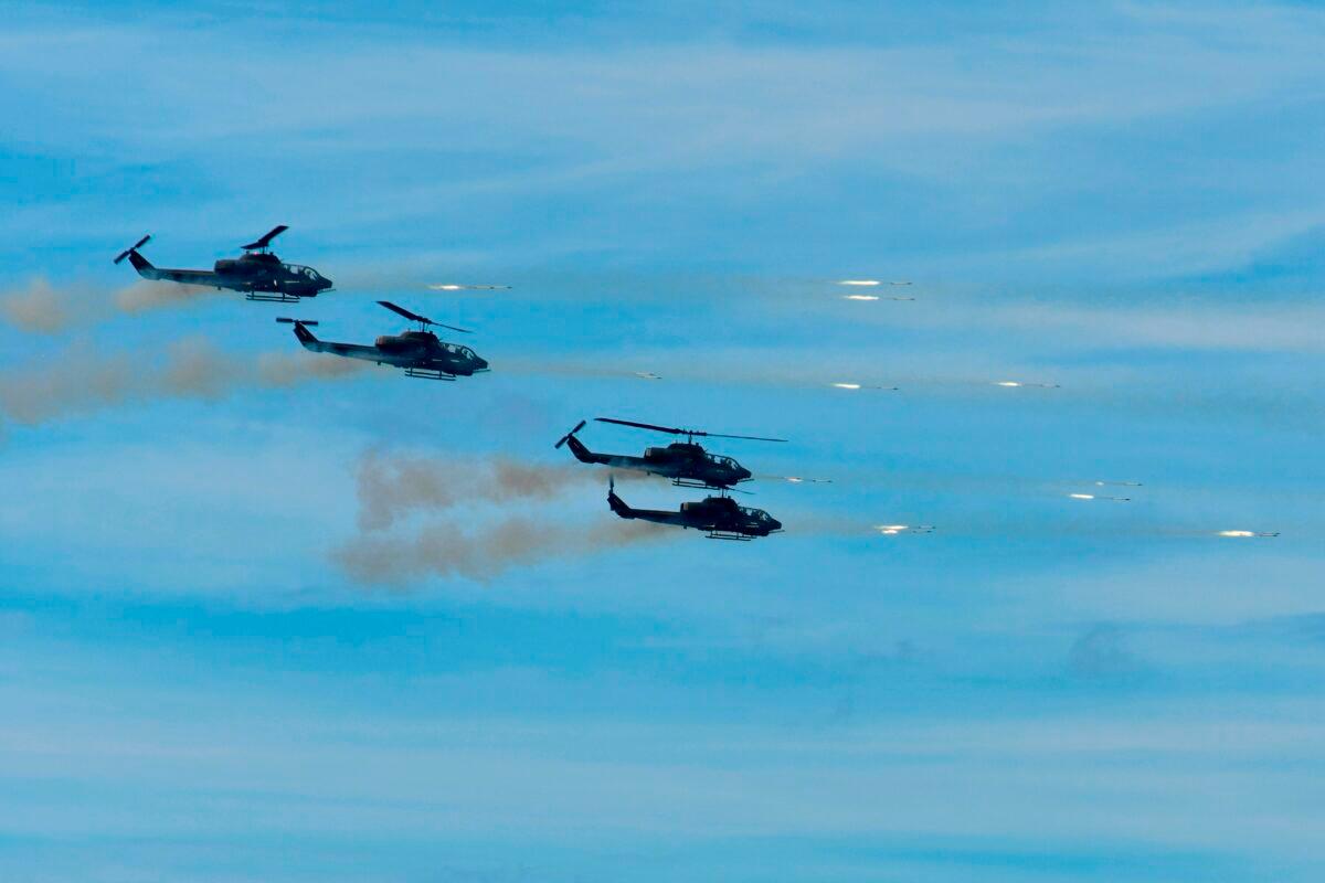 Four U.S.-made AH-1W SuperCobras attack helicopters launch rockets during the 35th "Han Kuang" military drill in southern Taiwan's Pingtung county on May 30, 2019. (Sam Yeh/AFP via Getty Images)