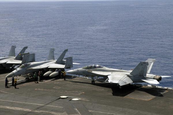 This photograph taken on October 16, 2019 shows U.S. Navy fighter jets on board USS Ronald Reagan in South China Sea on Oct. October 16, 2019.  (Catherine Lai/AFP via Getty Images)