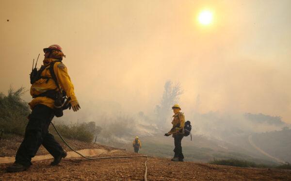 Firefighters work during the Silverado Fire in Orange County in Irvine, Calif., on Oct. 26, 2020. (Mario Tama/Getty Images)