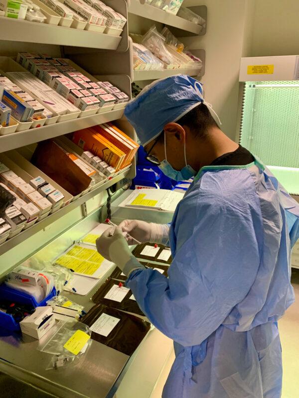 A researcher prepares for a trial COVID-19 vaccine at Hoag Memorial Hospital in Newport Beach, Calif. on Oct. 21, 2020. (Courtesy of Hoag Memorial Hospital)