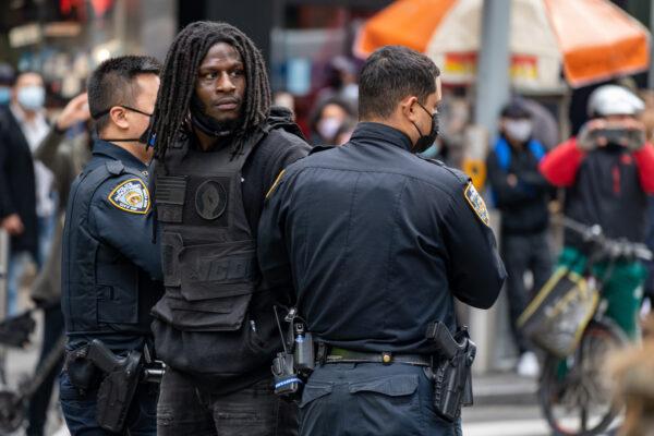 A person is arrested during a march and rally for President Donald Trump on 5th Avenue in New York on Oct. 25, 2020. (David Dee Delgado/Getty Images)