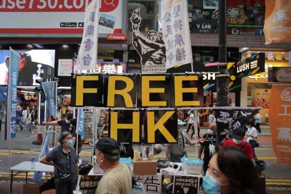 A booth with the sign "Free Hong Kong" is set up near Victoria Park where people gathered to mourn those killed in the 1989 Tiananmen massacre, in Hong Kong on June 4, 2020. (Kin Cheung/The Associated Press)