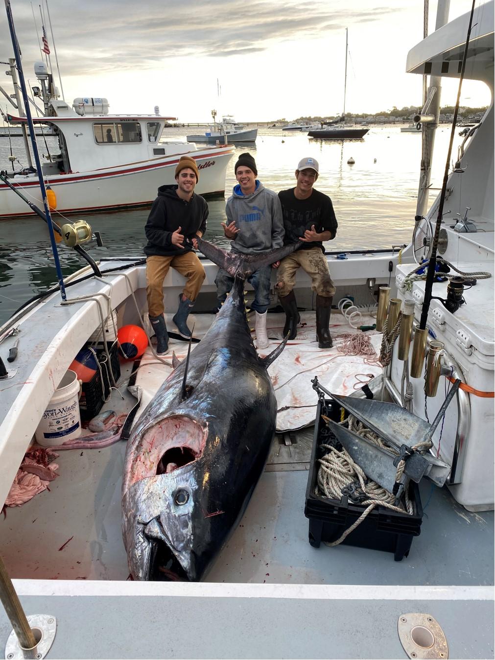 Dan Smith, Kyle Falle, and Jim McCormack with their catch. (Courtesy of <a href="https://www.julianicolecharters.com/">Dan Smith Sr.</a>)
