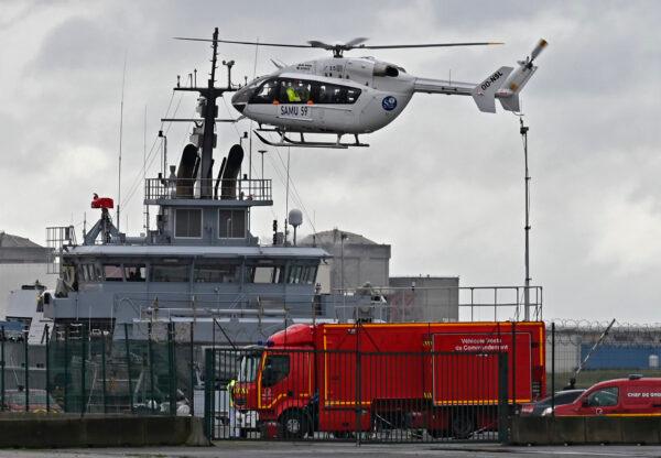 A French rescue helicopter lands close to a rescue vessel in Dunkirk, northern France, on Oct. 27, 2020, during a search operation. (AP Photo)