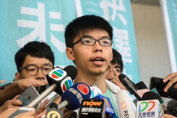 Pro-democracy political activist and a member of the Demosisto party, Joshua Wong, speaks to the media after leaving the Eastern Court in Hong Kong on July 21, 2016.<br/>(Anthony Wallace/AFP via Getty Images)