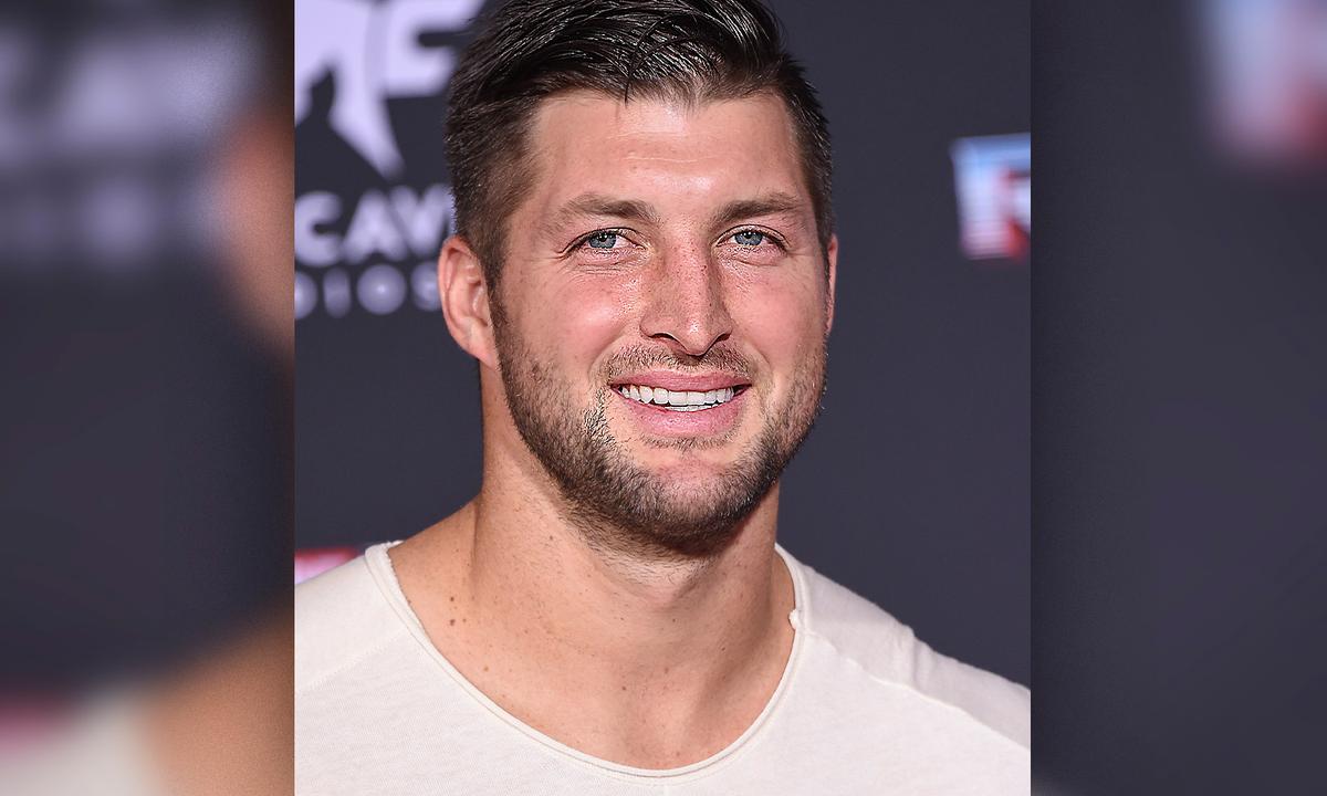 Tim Tebow Gives Shoes on His Own Feet to Resident in Need, Donates 50 More Pairs