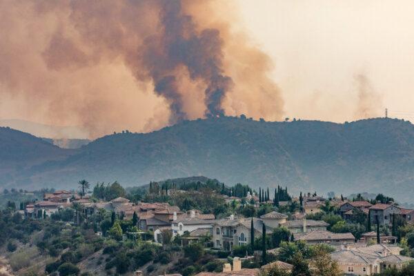 Smoke from the Blue Ridge Fire rises on a ridge above Yorba Linda, Calif., on Oct. 27, 2020. (John Fredricks/The Epoch Times)