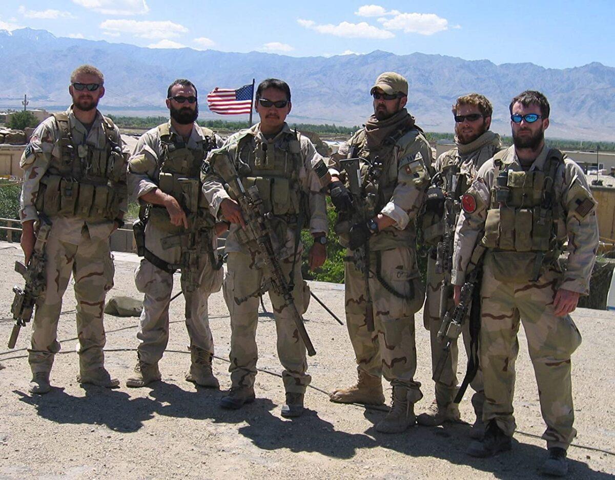 Navy SEALs operating in Afghanistan in support of Operation Enduring Freedom. (L–R) Sonar Technician (Surface) 2nd Class Matthew G. Axelson, Senior Chief Information Systems Technician Daniel R. Healy, Quartermaster 2nd Class James Suh, Hospital Corpsman 2nd Class Marcus Luttrell, Machinist's Mate 2nd Class Eric S. Patton, and Lt. Michael P. Murphy pose in Afghanistan. With the exception of Luttrell, the author of "Lone Survivor," all were killed June 28, 2005, by enemy forces while supporting Operation Red Wing. (Handout)