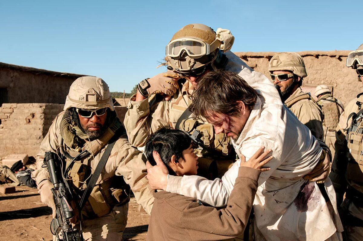 Mark Wahlberg (in white), as Navy SEAL Marcus Luttrell being rescued in “Lone Survivor.” (Greg Peters/Universal Pictures)
