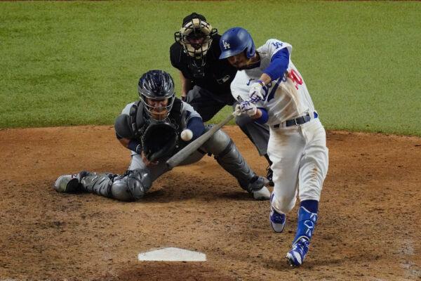 Los Angeles Dodgers' Mookie Betts hits a home run against the Tampa Bay Rays during the eighth inning in Game 6 of the baseball World Series in Arlington, Texas, on Oct. 27, 2020. (AP Photo/Sue Ogrocki)