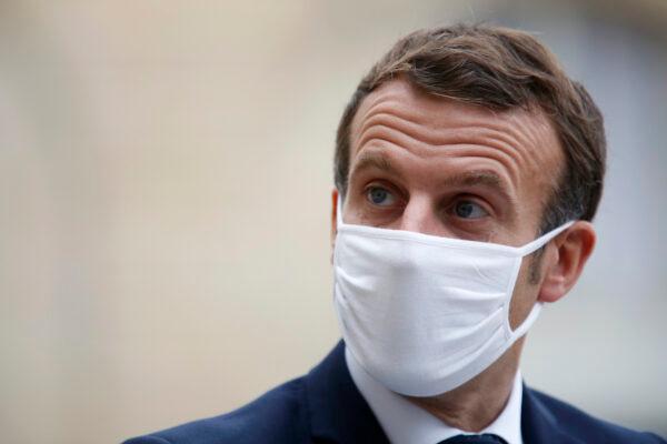 France's President Emmanuel Macron wears a mask at the Elysee Palace, in Paris, Oct. 28, 2020. (AP Photo/Thibault Camus)