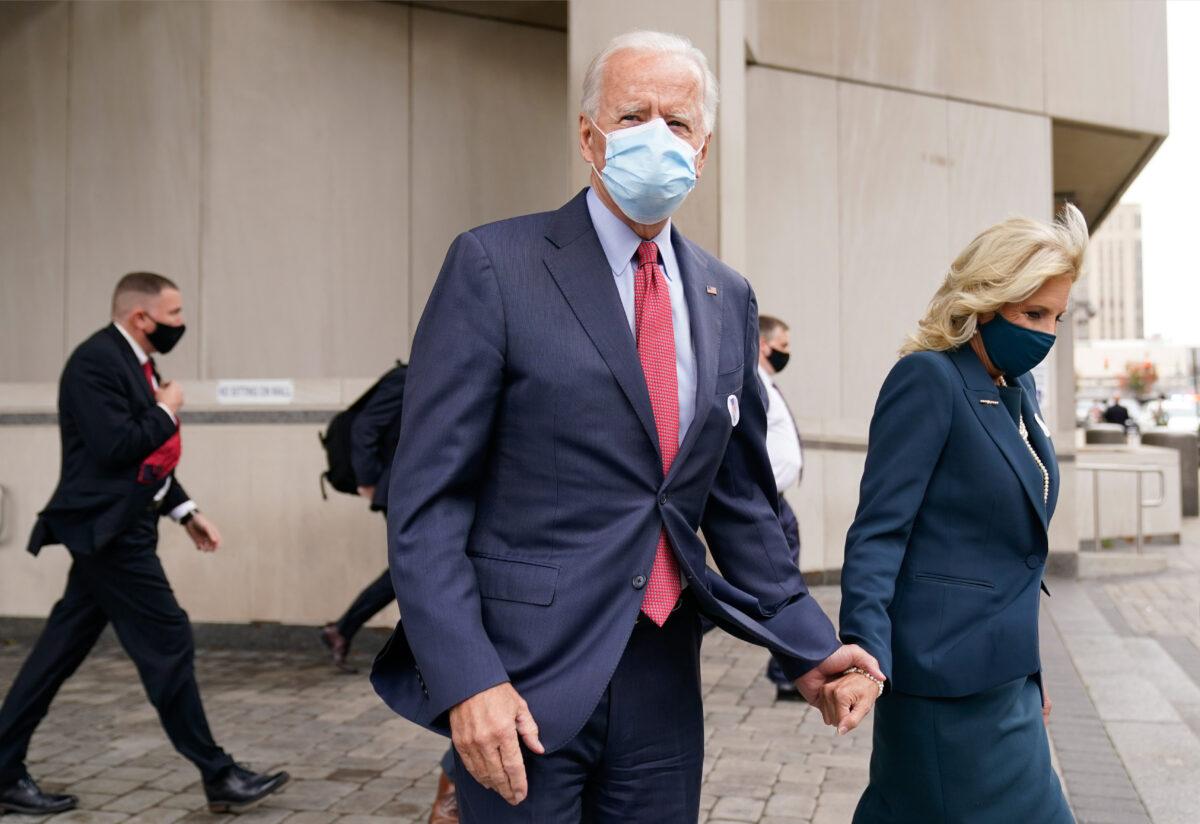 Democratic presidential candidate former Vice President Joe Biden and his wife Jill Biden leave after they voted at the Carvel State Office Building in Wilmington, Del., on Oct. 28, 2020. (Andrew Harnik/AP Photo)
