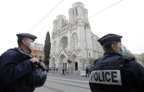  Police officers stand guard at the scene of a knife attack at Notre Dame church in Nice, France, on Oct. 29, 2020. (Eric Gaillard/Pool/Reuters)