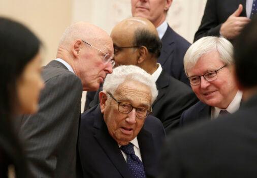 Members of a delegation from the 2019 New Economy Forum, former US Treasury Secretary Henry Paulson (L), former US Secretary of State Henry Kissinger (C) and former Australian Prime Minister Kevin Rudd (R) chat before a meeting with China's President Xi Jinping (not pictured) at the Great Hall of the People in Beijing on November 22, 2019. (Jason Lee/POOL/AFP via Getty Images)