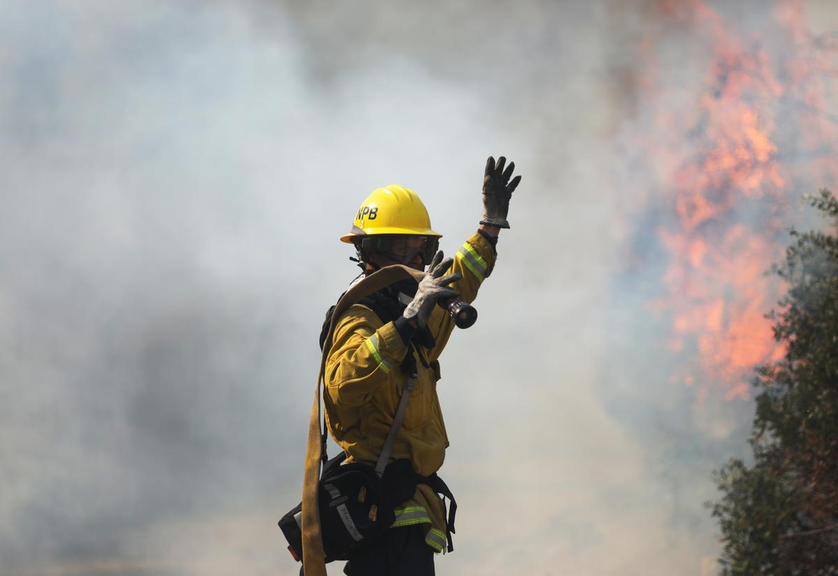 A firefighter works during the Silverado Fire in Orange County on Oct. 26, 2020, in Irvine, Calif. (Mario Tama/Getty Images)