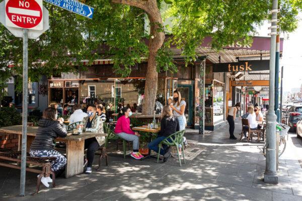 People enjoy outdoor dining at Tusk Cafe in Prahran in Melbourne, Australia, on Oct. 28, 2020. (Daniel Pockett/Getty Images)