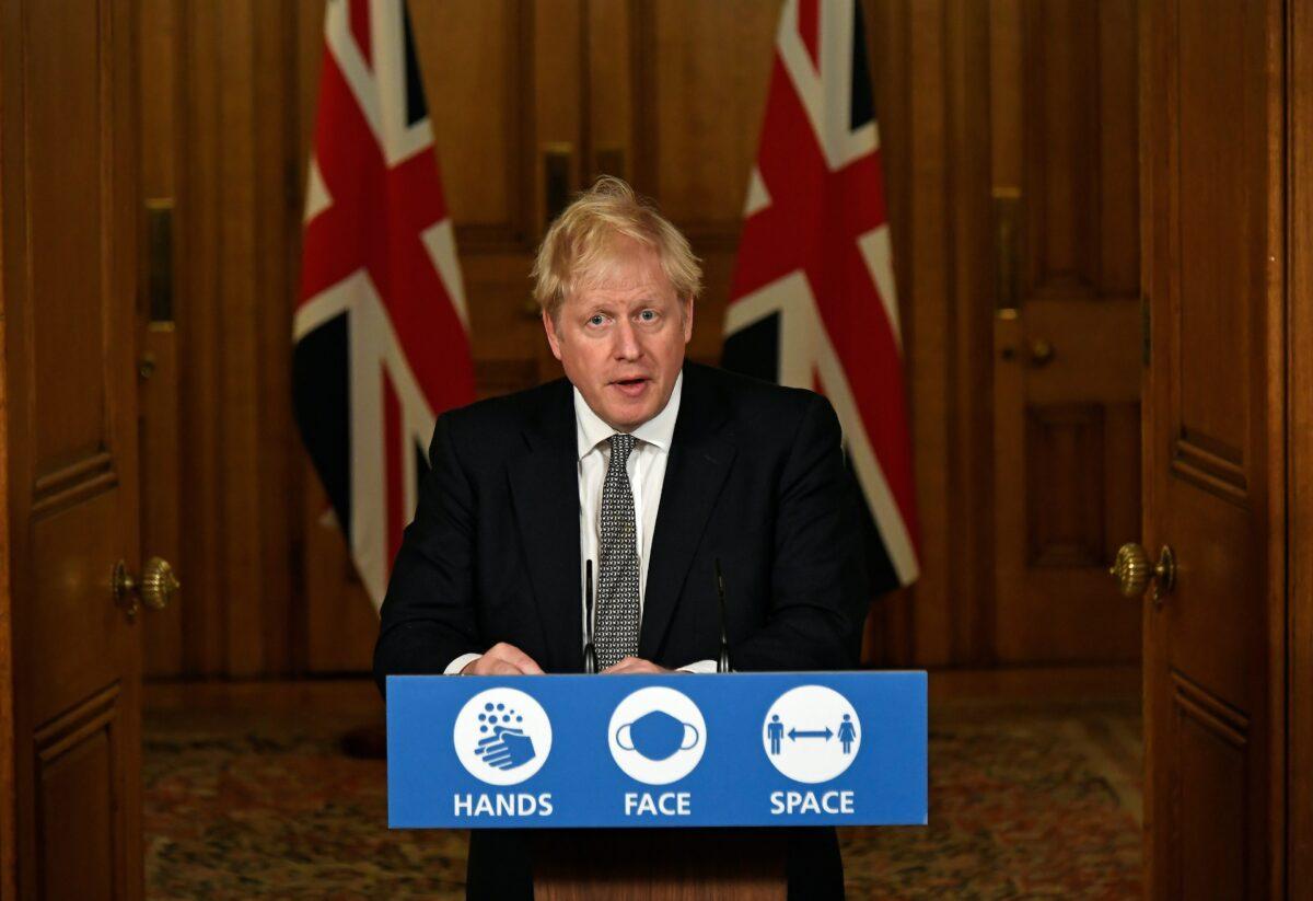 Britain's Prime Minister Boris Johnson gestures as he speaks during a press conference where he announces new restrictions to help combat the coronavirus disease (COVID-19) outbreak, at 10 Downing Street in London, on Oct. 31, 2020. (Alberto Pezzali/Pool via Reuters)