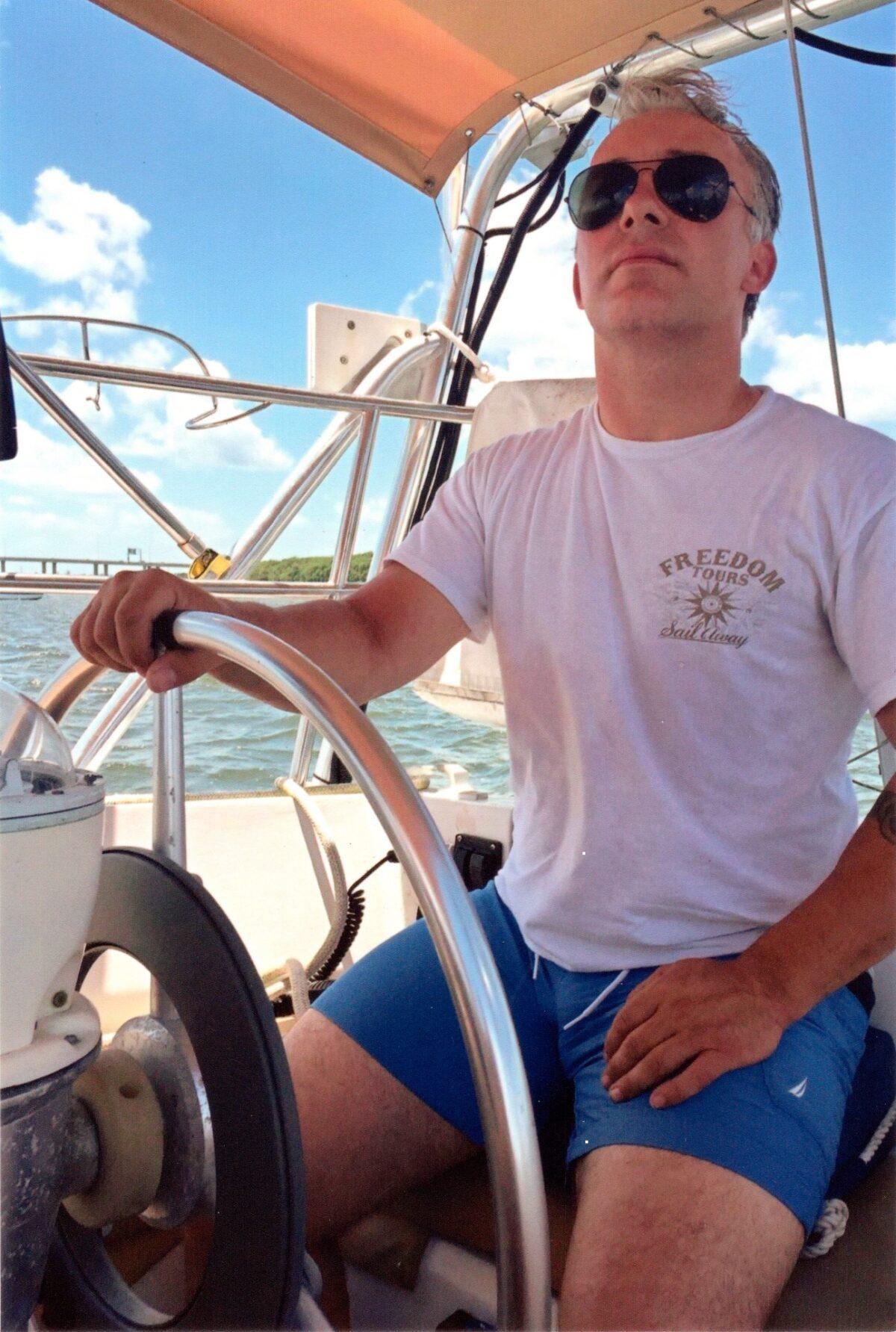 Matthew Heath navigates a boat near the Florida Keys. (Courtesy of the Heath family via AP)