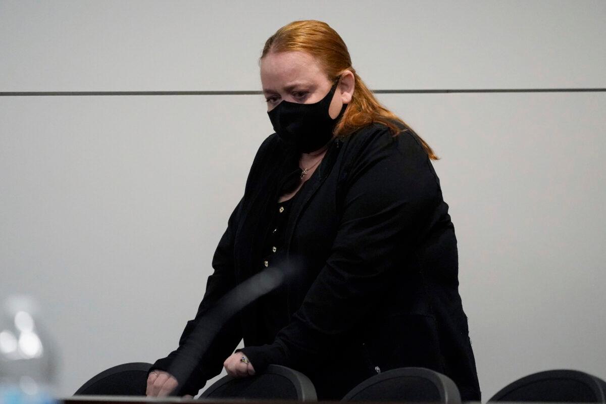 Kyle Rittenhouse's mother Wendy Rittenhouse stands up after an extradition hearing in Lake County court in Waukegan, Ill., Friday, Oct. 30, 2020. (Nam Y. Huh/AP Photo, Pool)