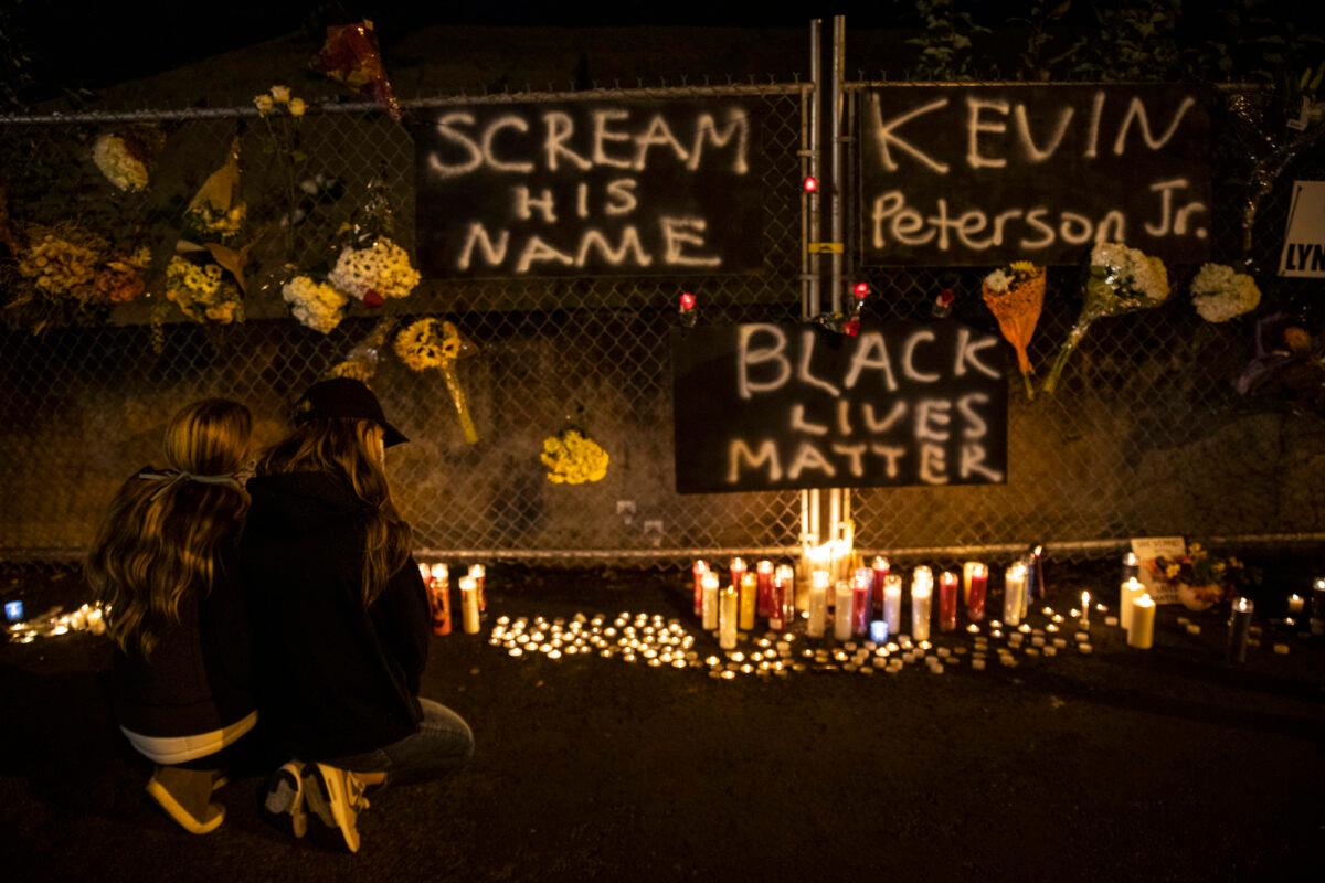 People gather at a candlelight vigil for Kevin Peterson Jr., who was shot by police on Thursday night, in Vancouver, Wa., on Oct. 30, 2020. (Paula Bronstein/AP Photo)
