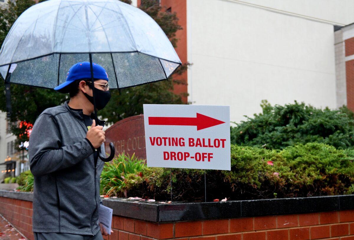 A voter arrives to drop off his ballot during early voting in Allentown, Pa., on Oct. 29, 2020. (Angela Weiss/AFP via Getty Images)